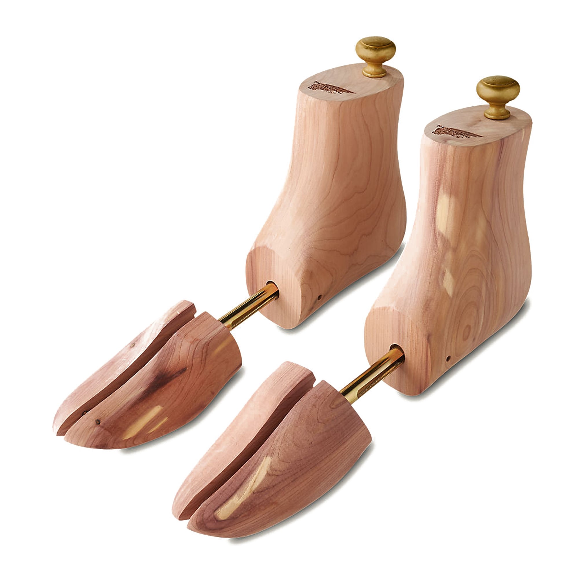 Pair of cedar wood shoe trees with brass knobs, ideal for maintaining shoe shape and freshness.