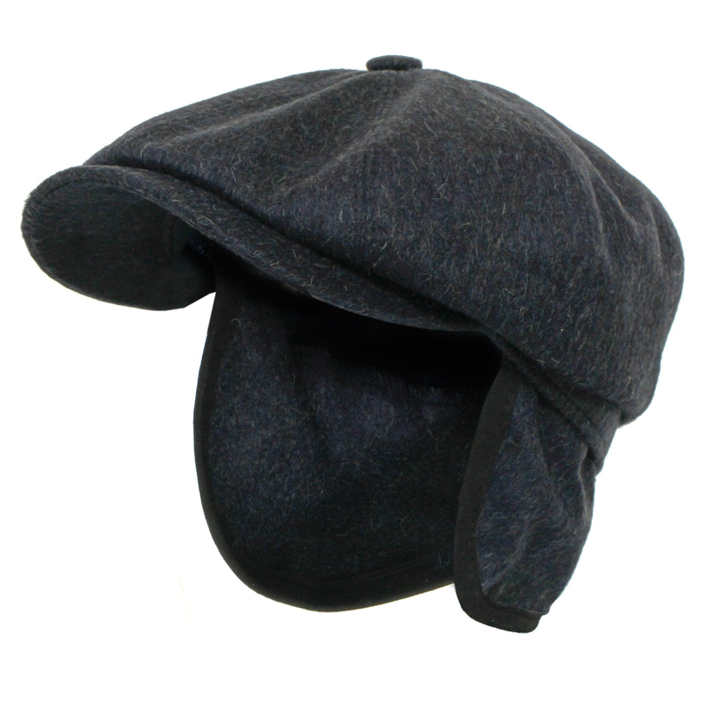 Dark grey herringbone flat cap with ear flaps extended, viewed from the front-left.