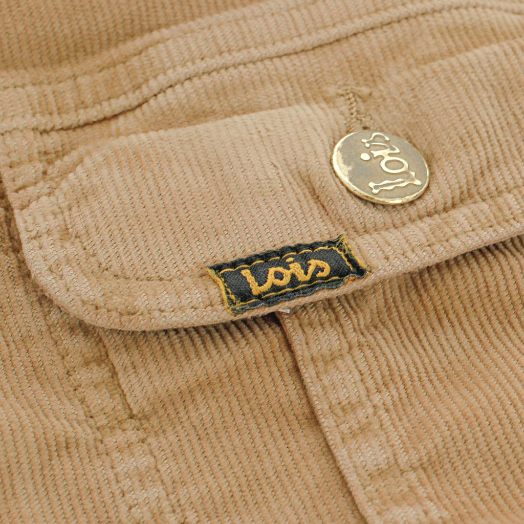 Close-up of the Lois logo label and a button on the corduroy jacket.