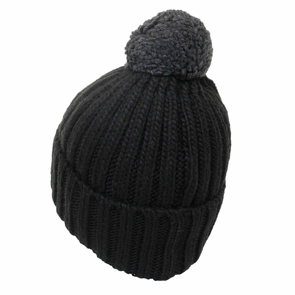 A black knitted bobble hat with a dark grey pom-pom, viewed from the side.