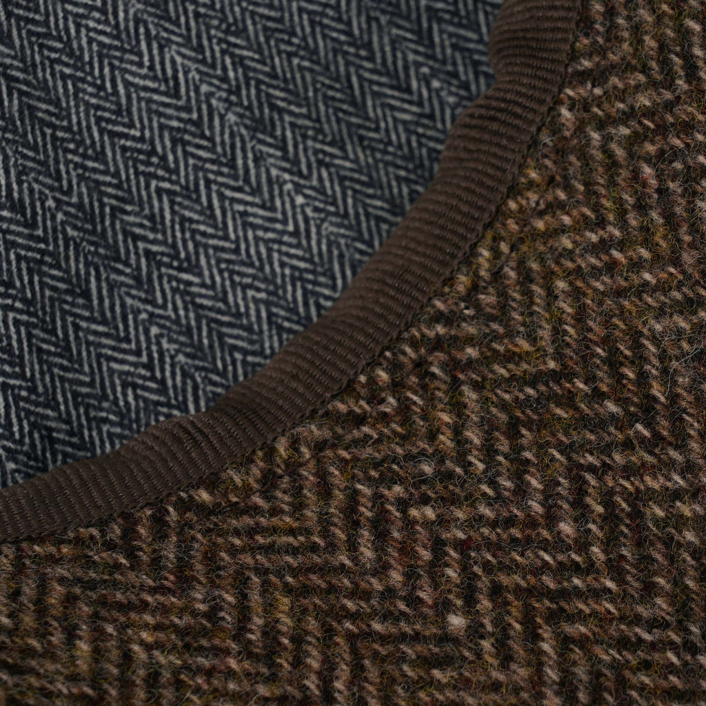 Close-up of the contrasting blue and brown herringbone patterns of the cap.