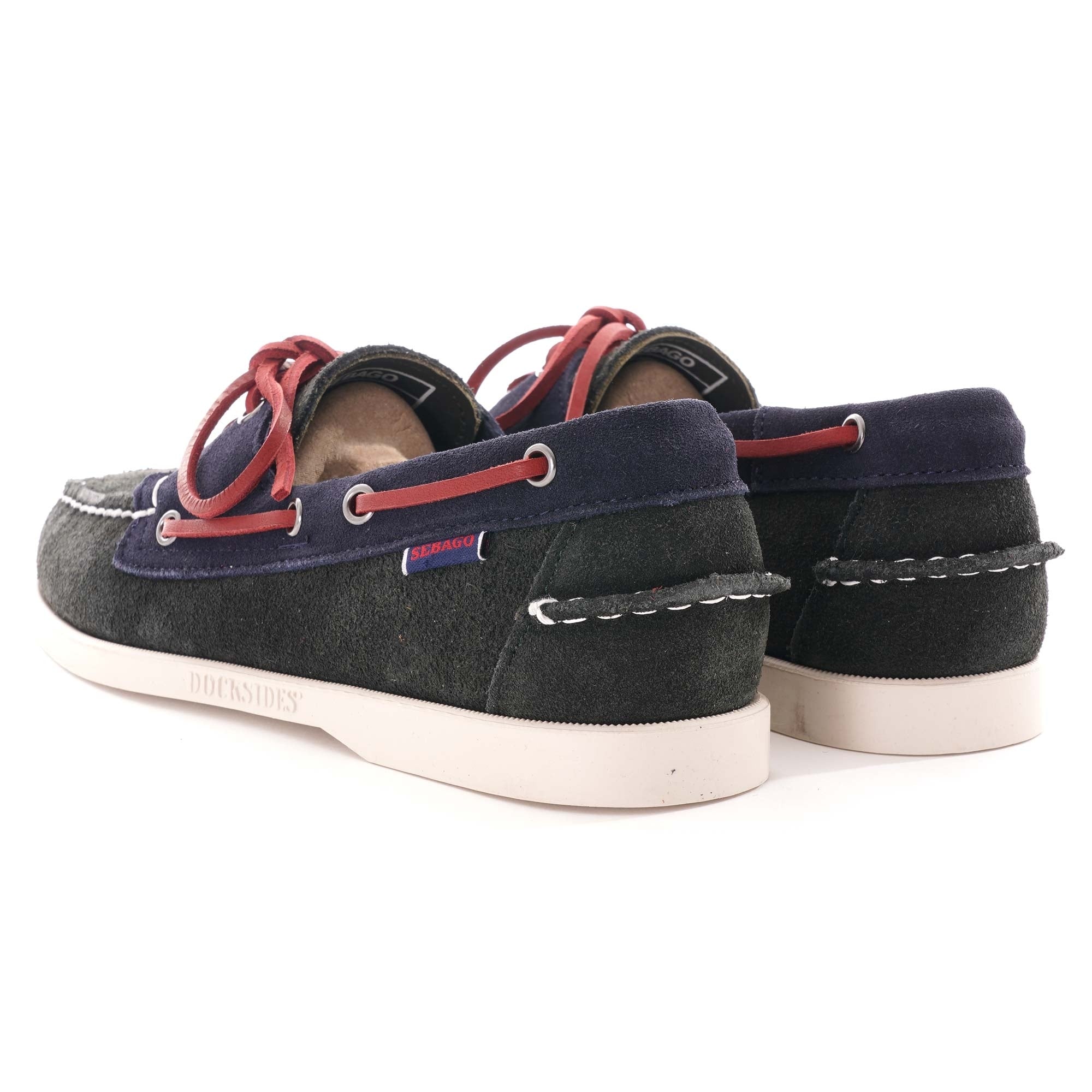 A pair of Sebago Baracuta Portland boat shoes with red laces, rear view.