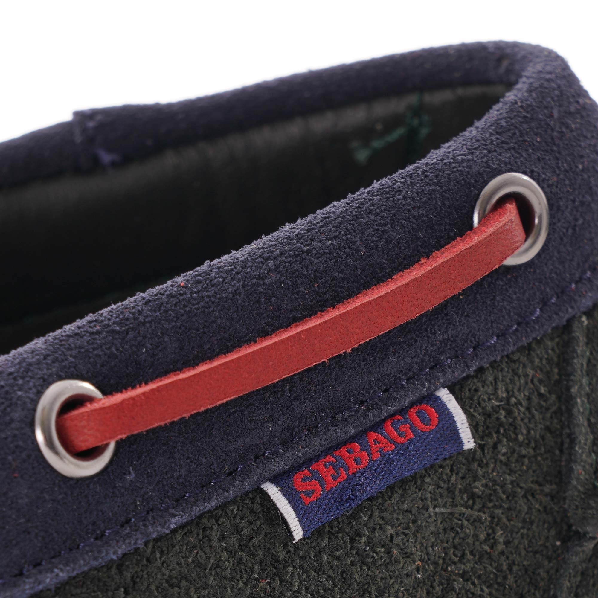 Close-up of the red laces and 'Sebago' label on a Portland boat shoe.