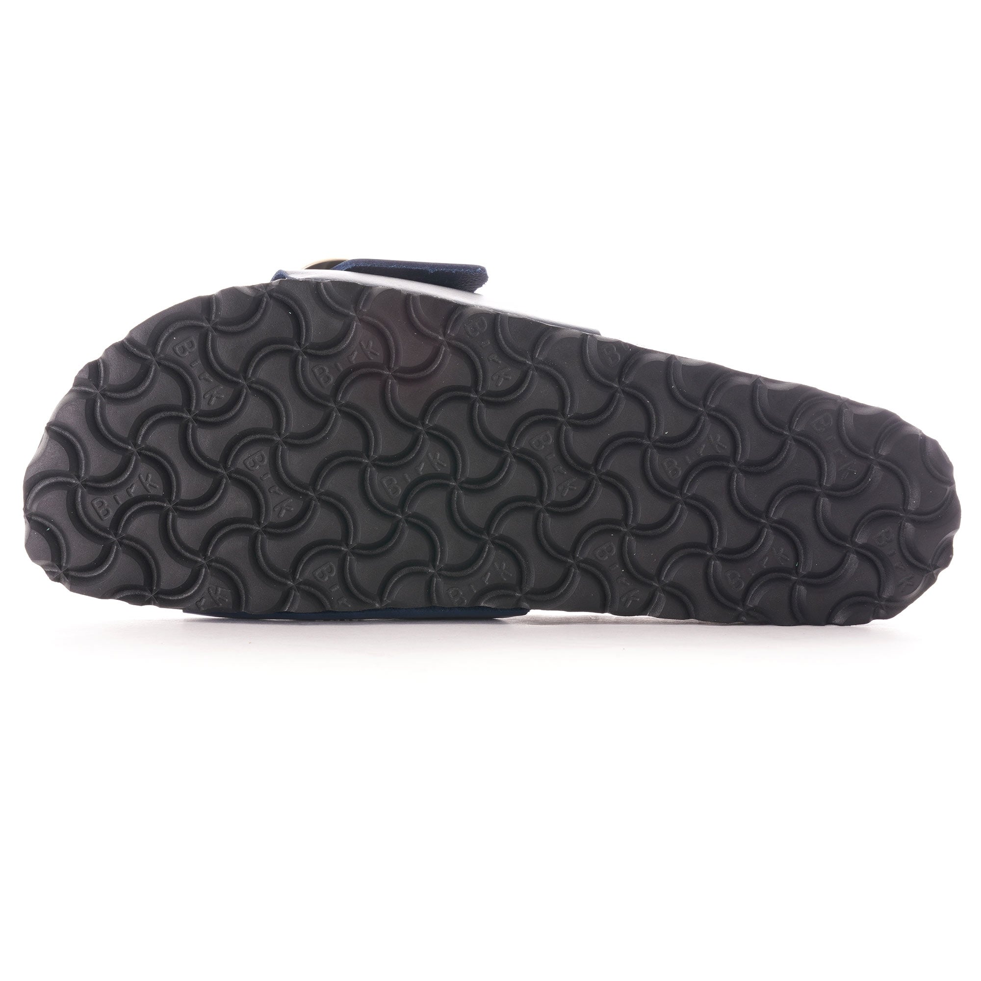 Bottom view of a navy blue sandal showing the patterned black sole.