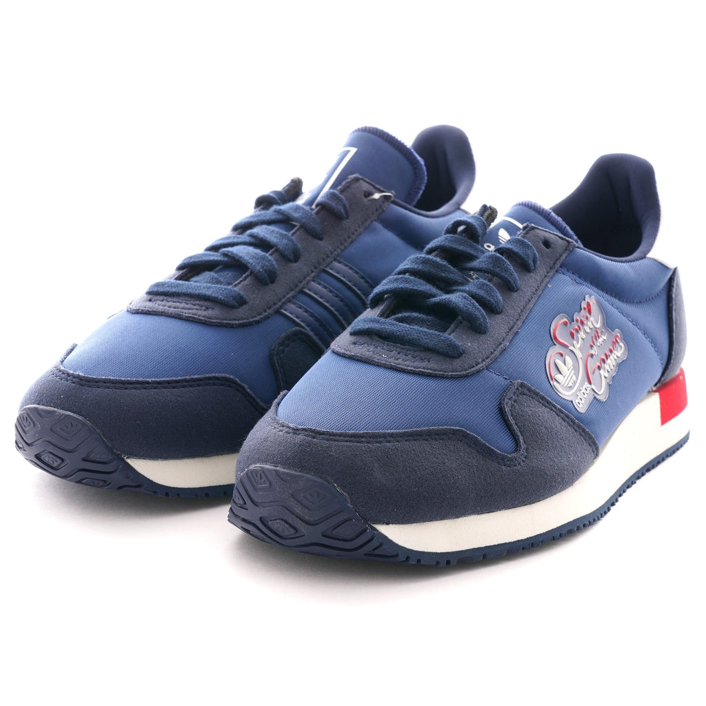 A pair of navy blue Adidas TRX Soulround shoes, angled to show both sneakers.