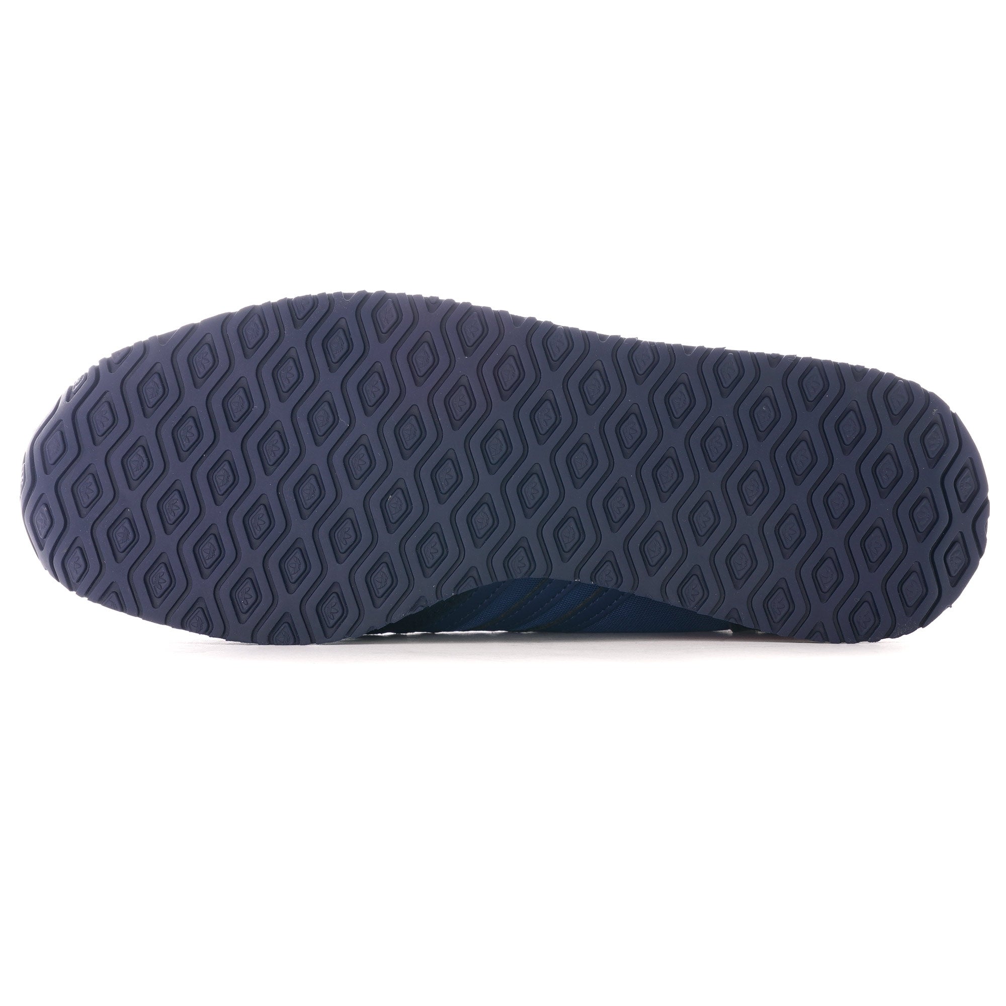 The sole of an Adidas TRX Soulround shoe, highlighting its unique grip pattern.