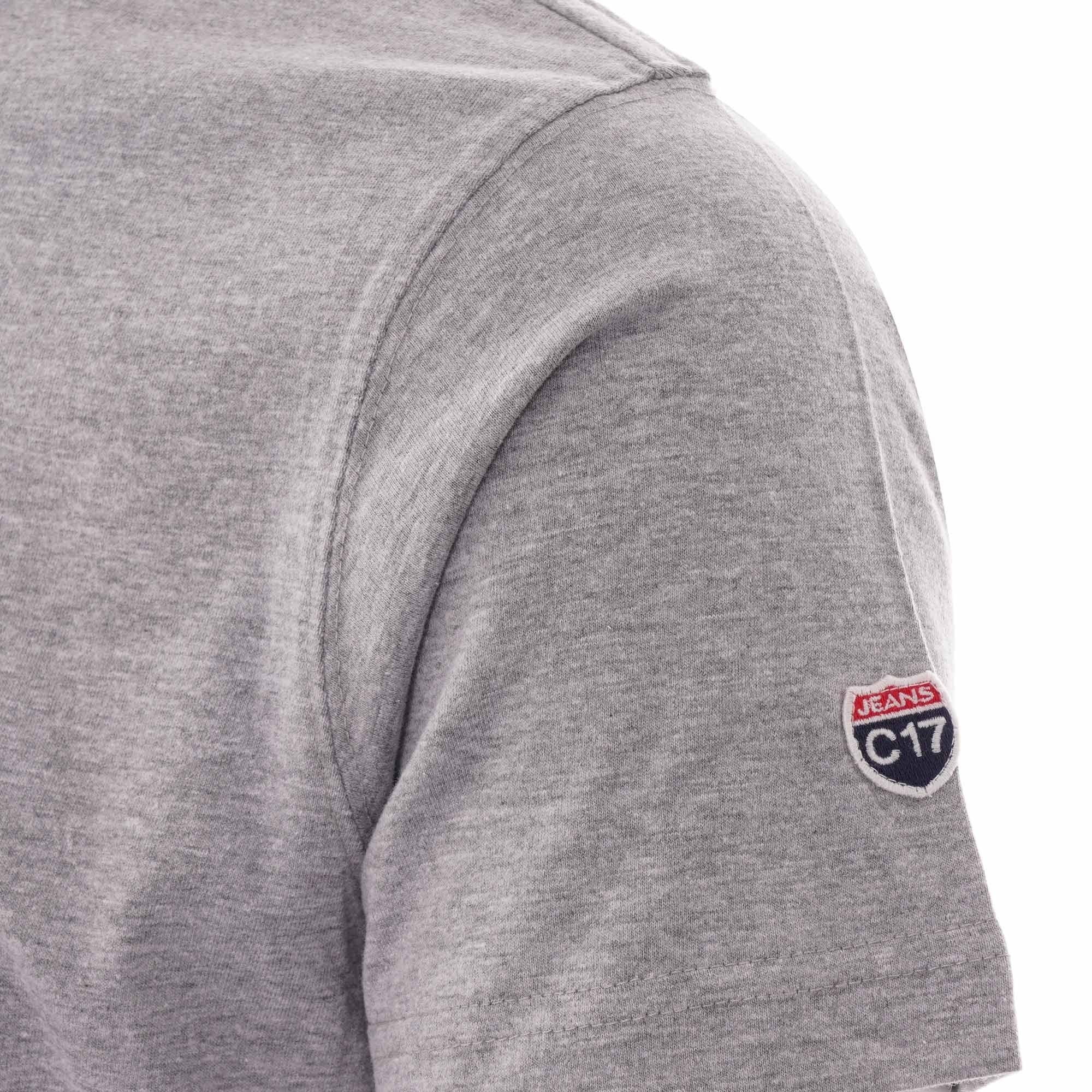 The left sleeve of a grey T-shirt featuring a 'C17 Jeans' patch.