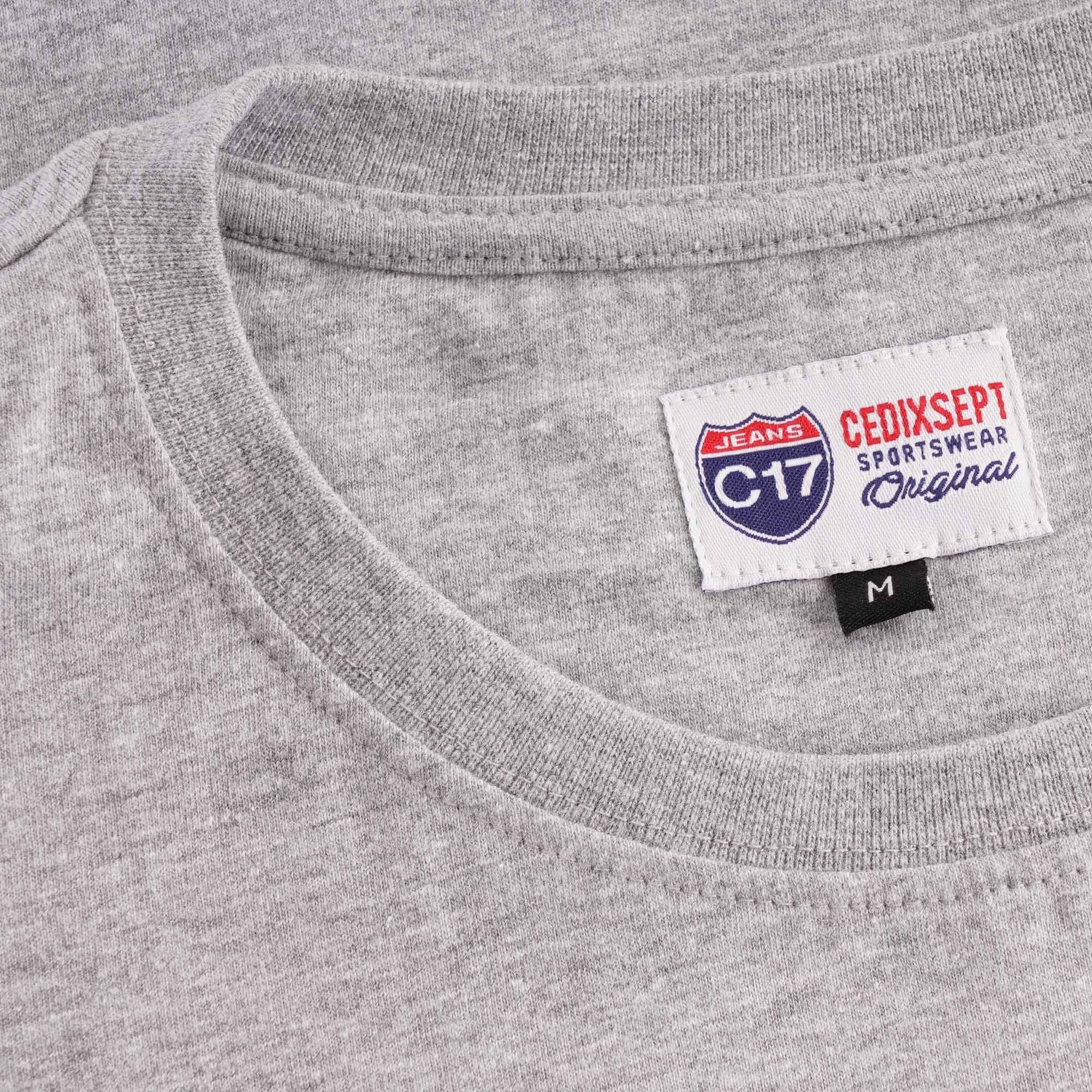 The collar area of a grey T-shirt with a branded 'C17 CEDIXSEPT' label.