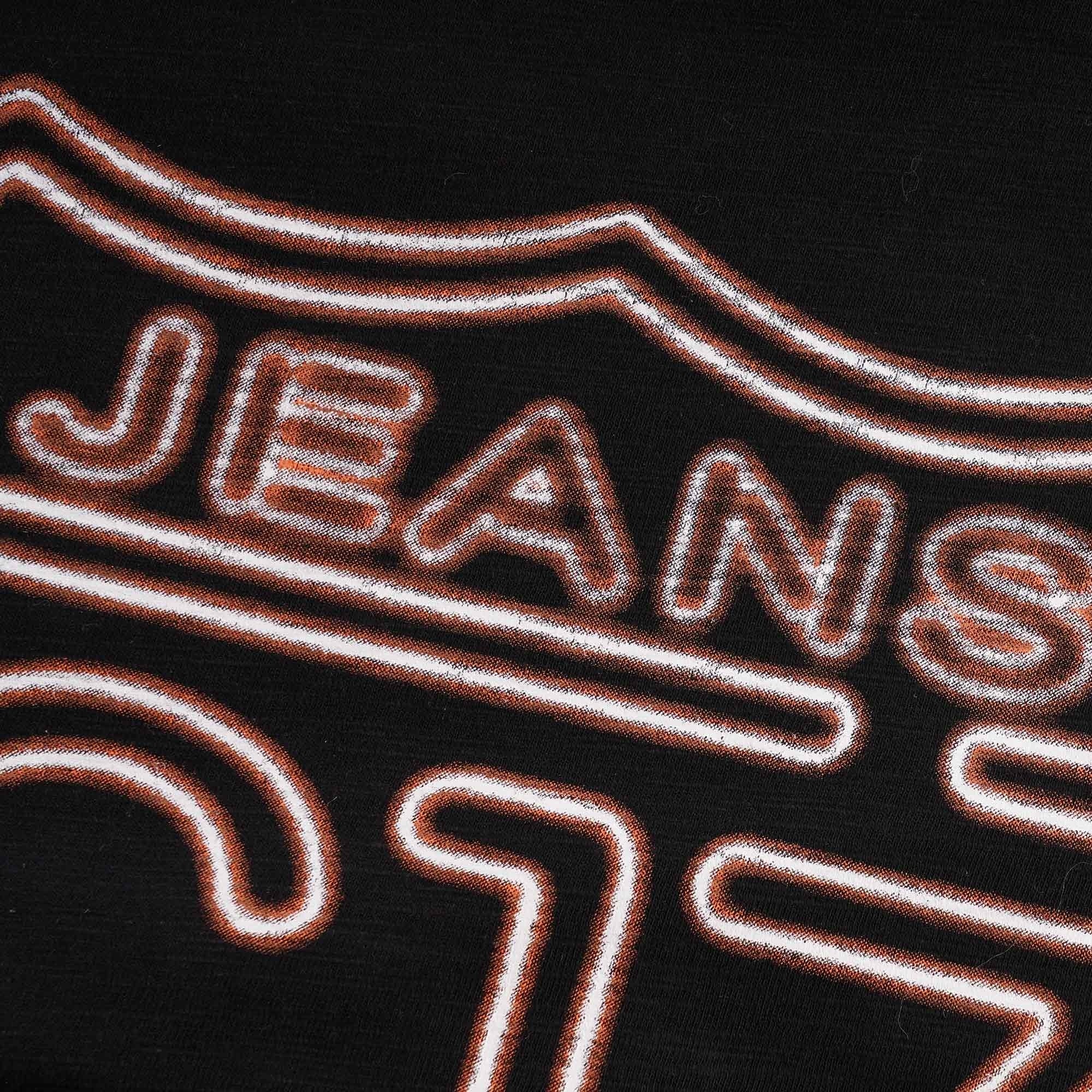 A close up of the C17 Jeans logo on the front of a black t-shirt.