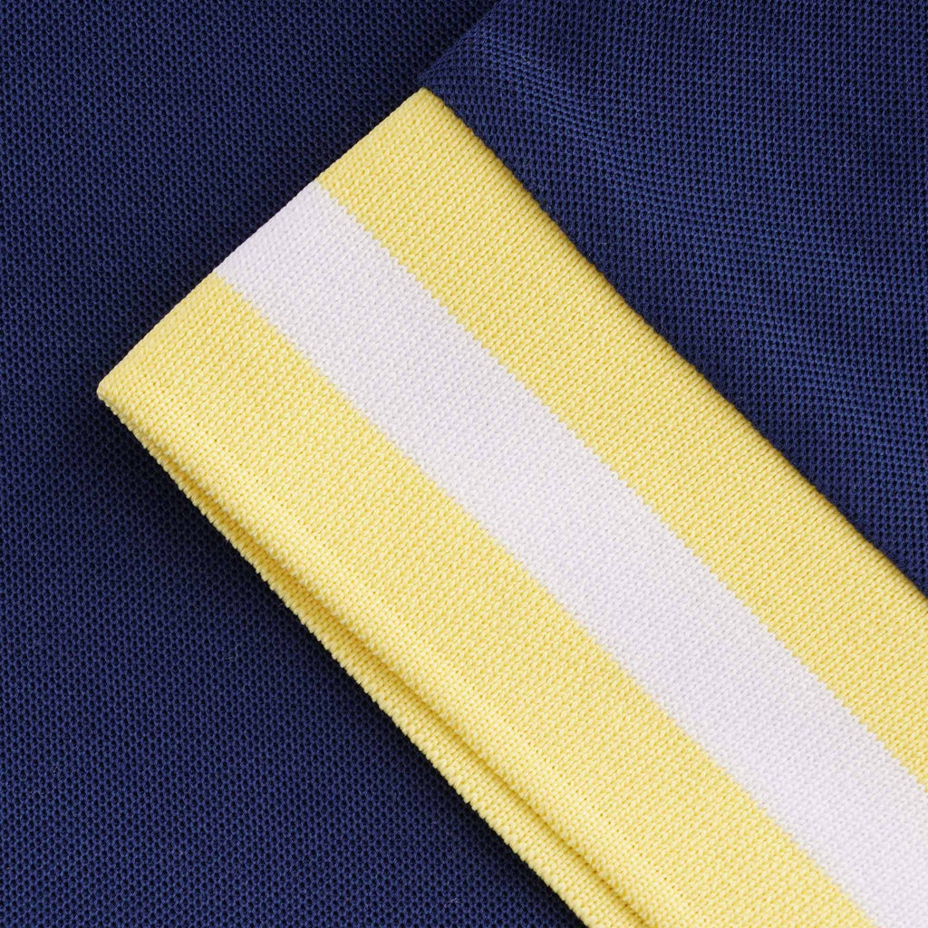 Close-up of the t-shirt's sleeve cuff, showing yellow and white stripes.