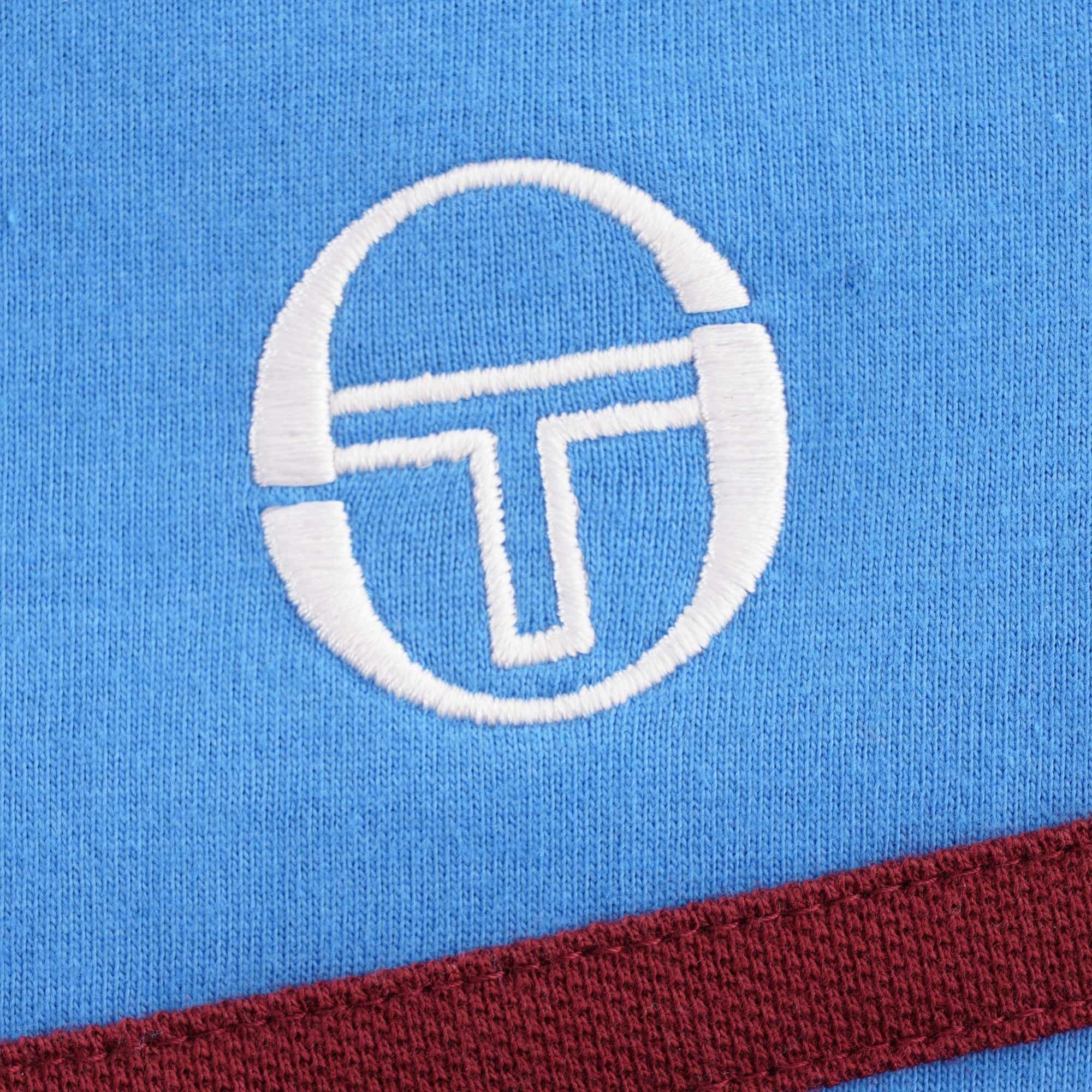 Detail of the embroidered Sergio Tacchini logo on the Young Line T-Shirt.