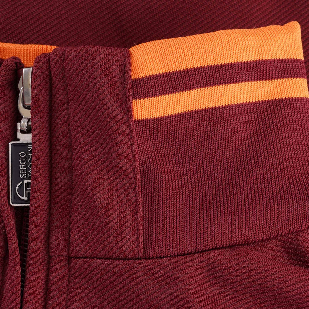 A close-up of the collar of the Sergio Tacchini Orion Track Top, showing the orange stripes.