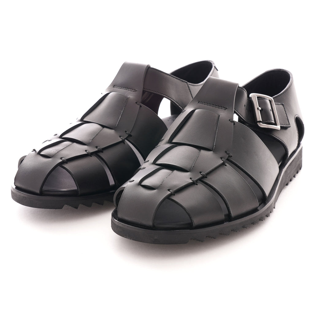 A pair of black leather fisherman sandals from a slightly elevated front view.