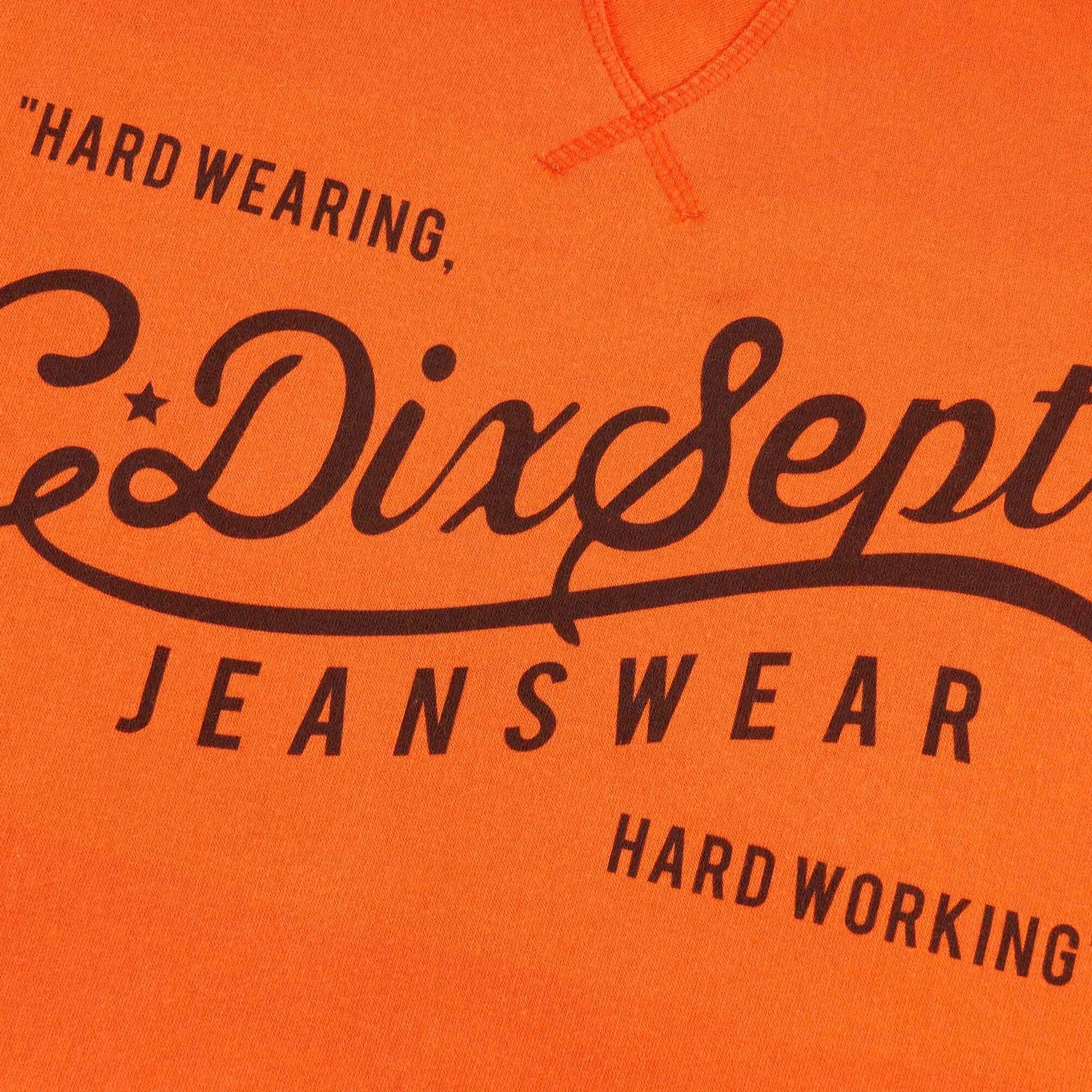 Close-up of the 'C17 Dixsept Jeanswear' logo on the orange hoodie.