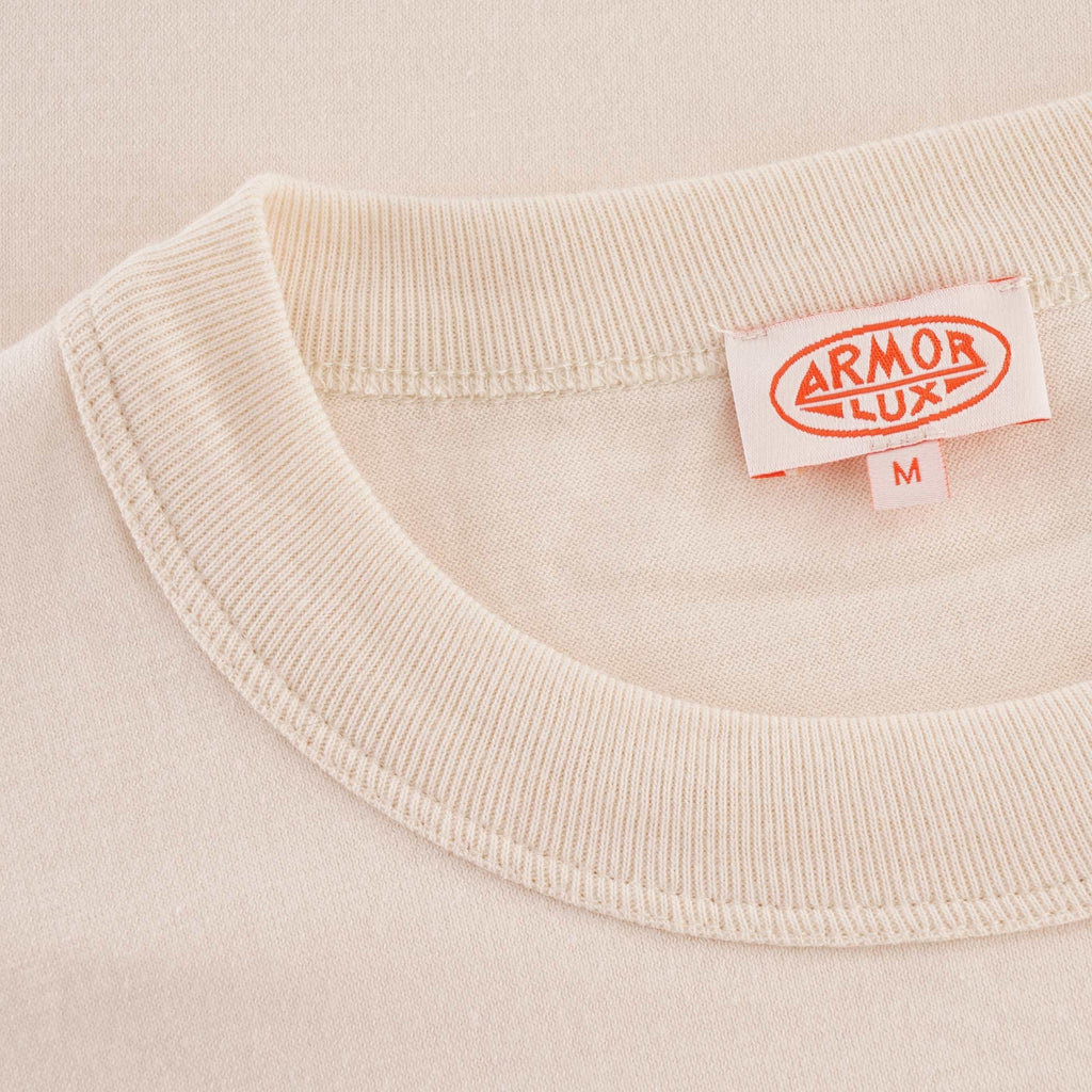 A close-up view of the Armor Lux brand tag on the Loctudy T-Shirt.