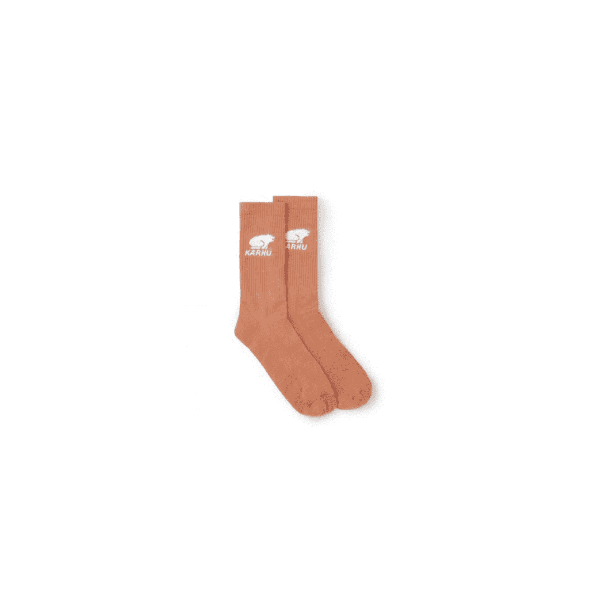 A pair of terracotta-coloured socks with a polar bear logo.