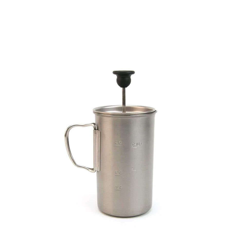 A stainless steel coffee press with its plunger raised is set against a white background.