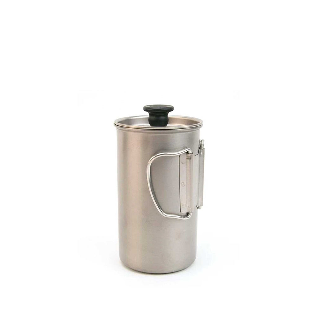 A stainless steel travel coffee press is shown with its handle folded for compact storage.