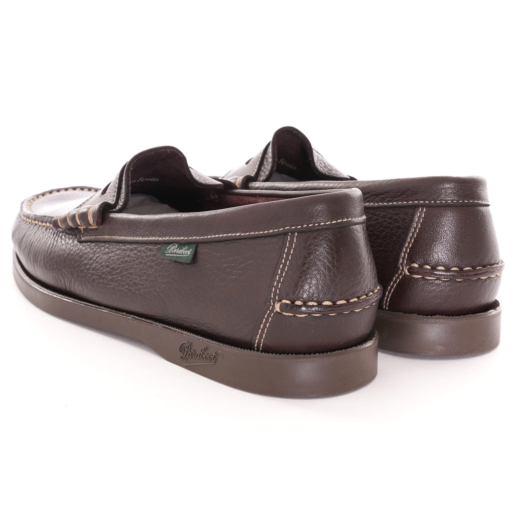 Rear view of a pair of brown leather Paraboot Coraux loafers.