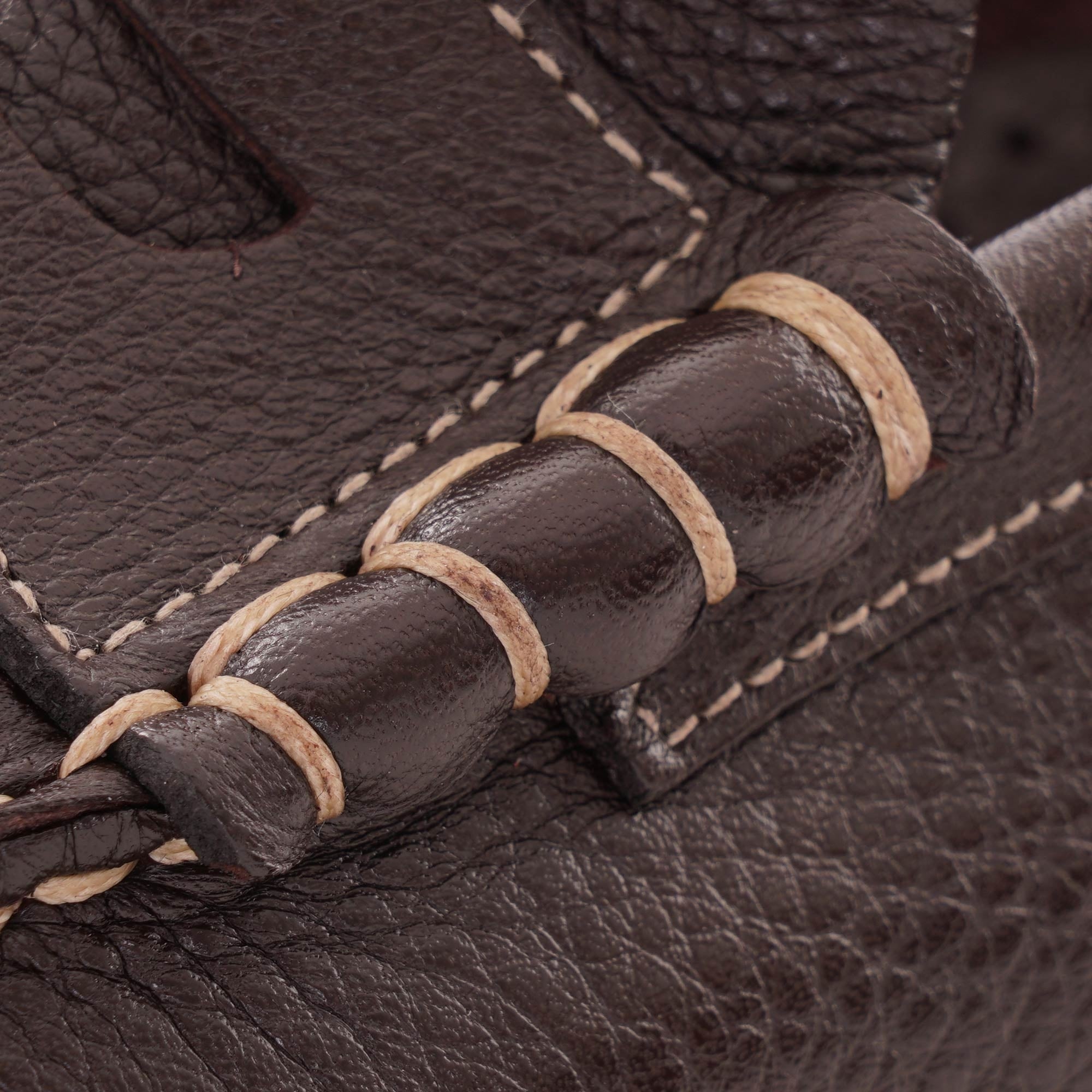Close-up of the penny keeper detail on the brown Paraboot Coraux loafer.