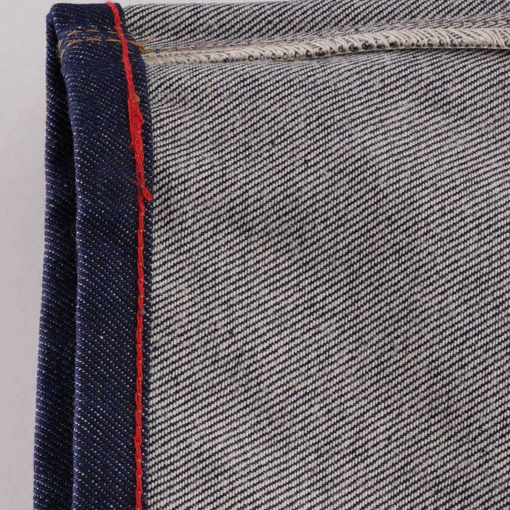 Detail of the selvedge denim edge with red stitching on C17 jeans.