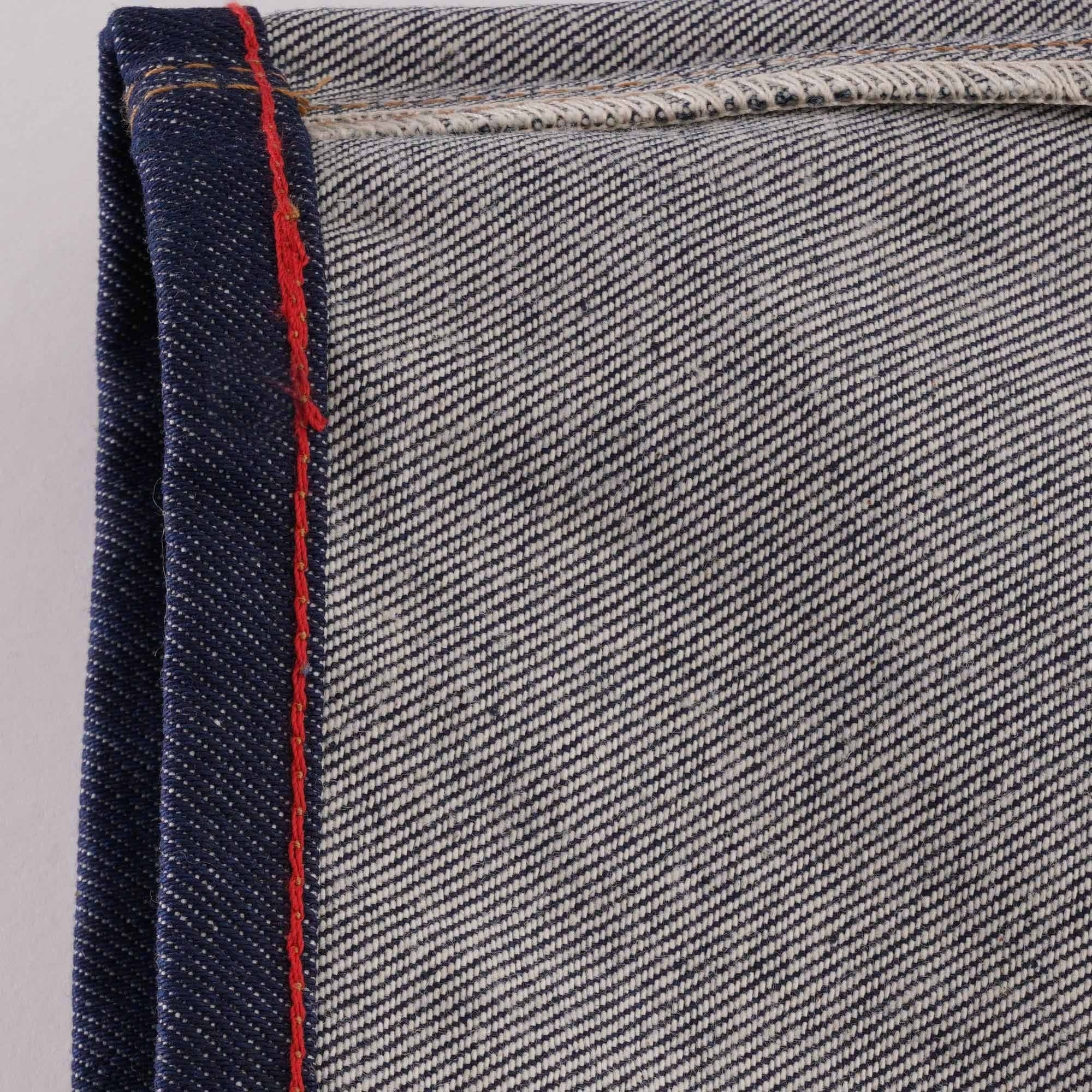 Detail of the selvedge denim edge with red stitching on C17 jeans.
