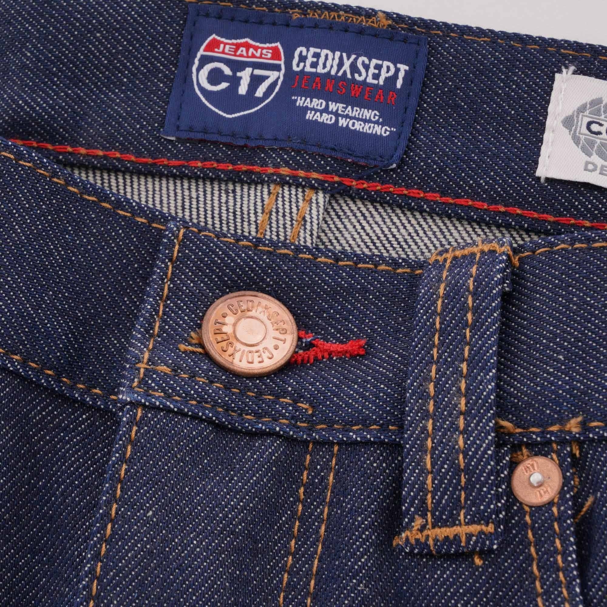 Close-up of the waistband of C17 jeans, showing button and brand label.