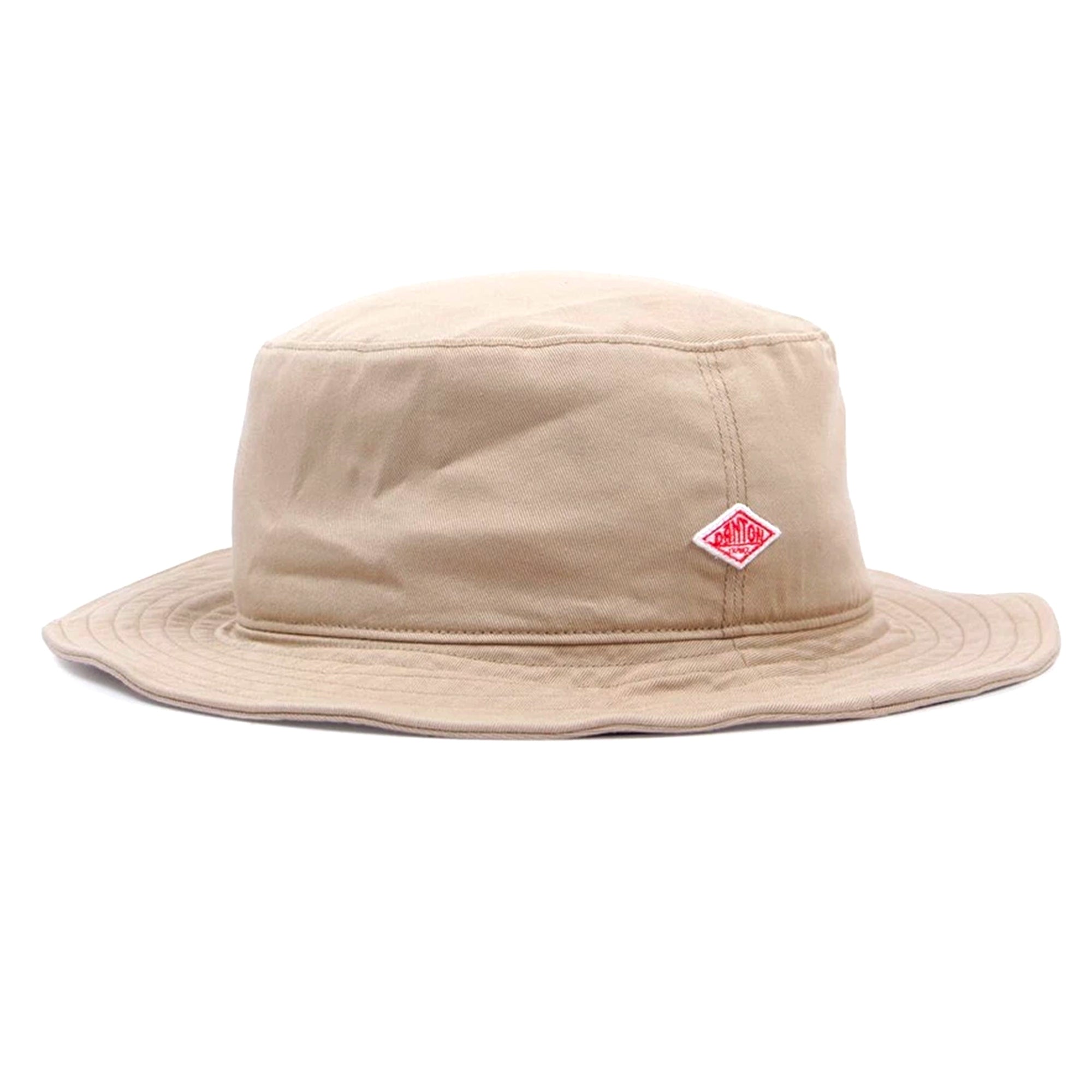 Beige bucket hat with a red diamond logo on a white background.