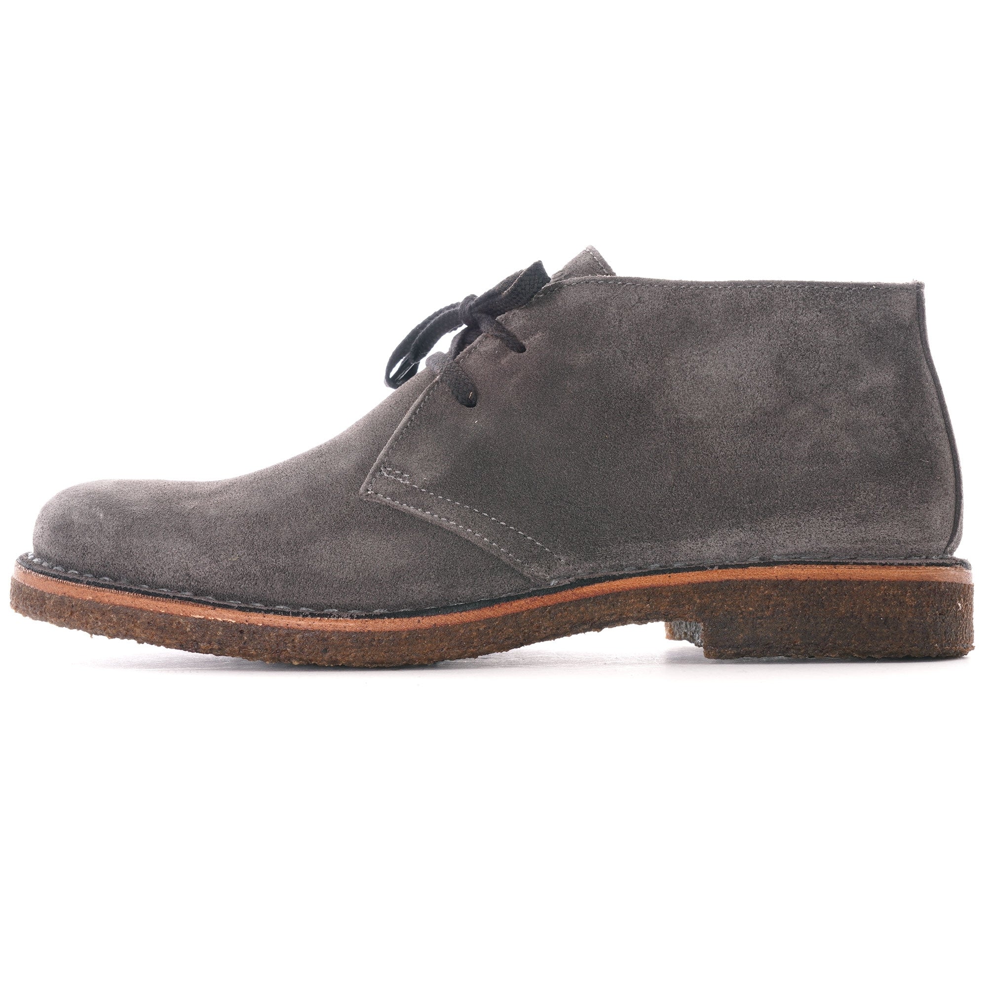 Side profile of a single grey suede desert boot with black laces and a brown sole.