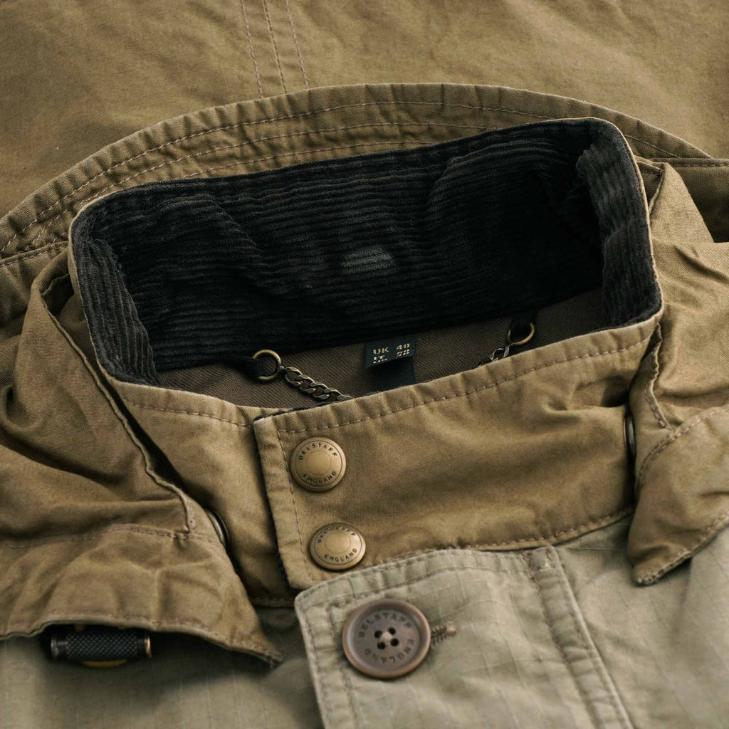 Close-up of the Belstaff Fieldmaster Jacket's collar with corduroy lining and button details.