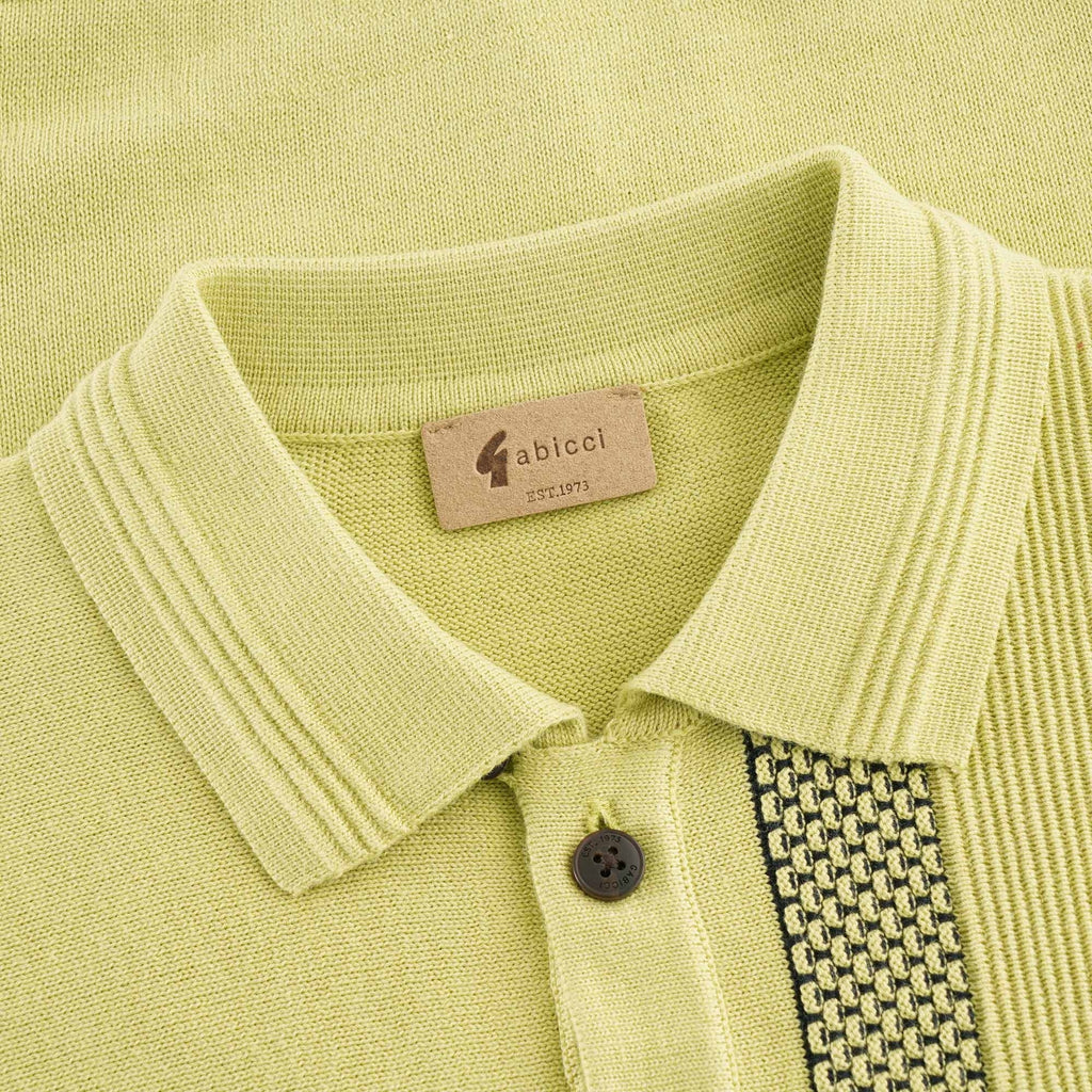 Close-up of the polo shirt's collar and buttons, showing the brand label.