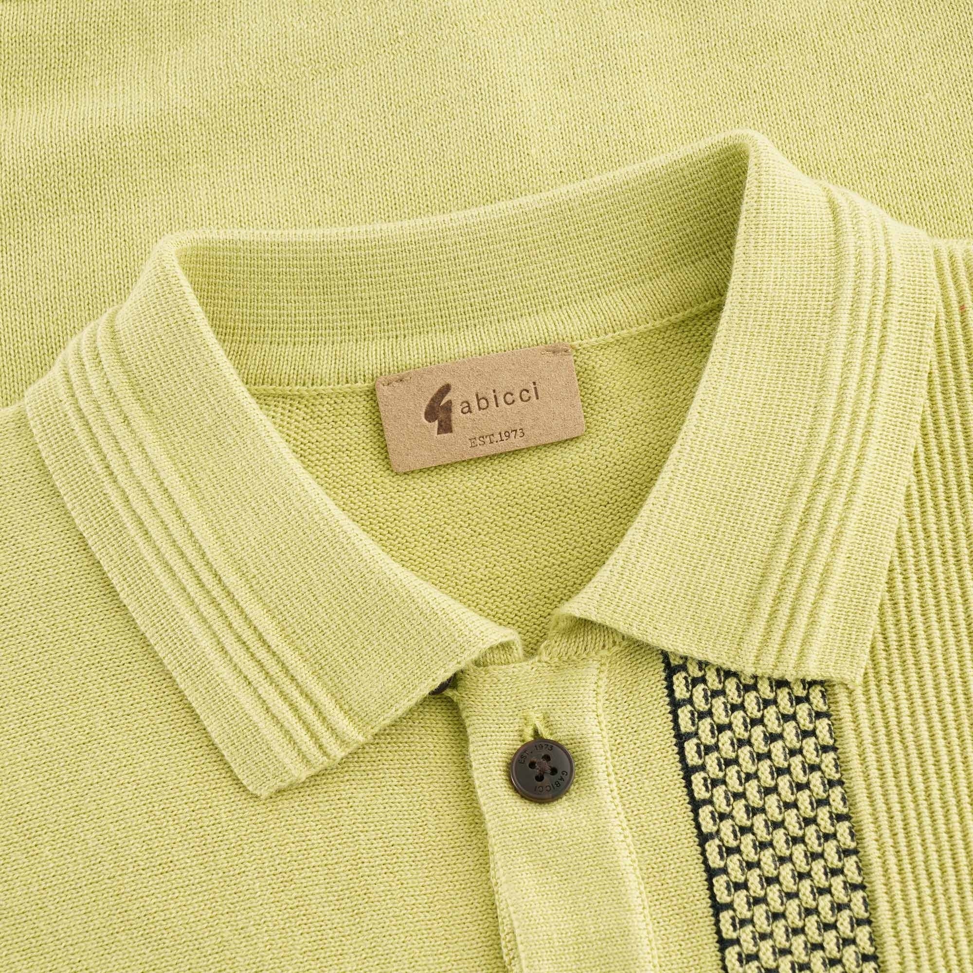 Close-up of the polo shirt's collar and buttons, showing the brand label.
