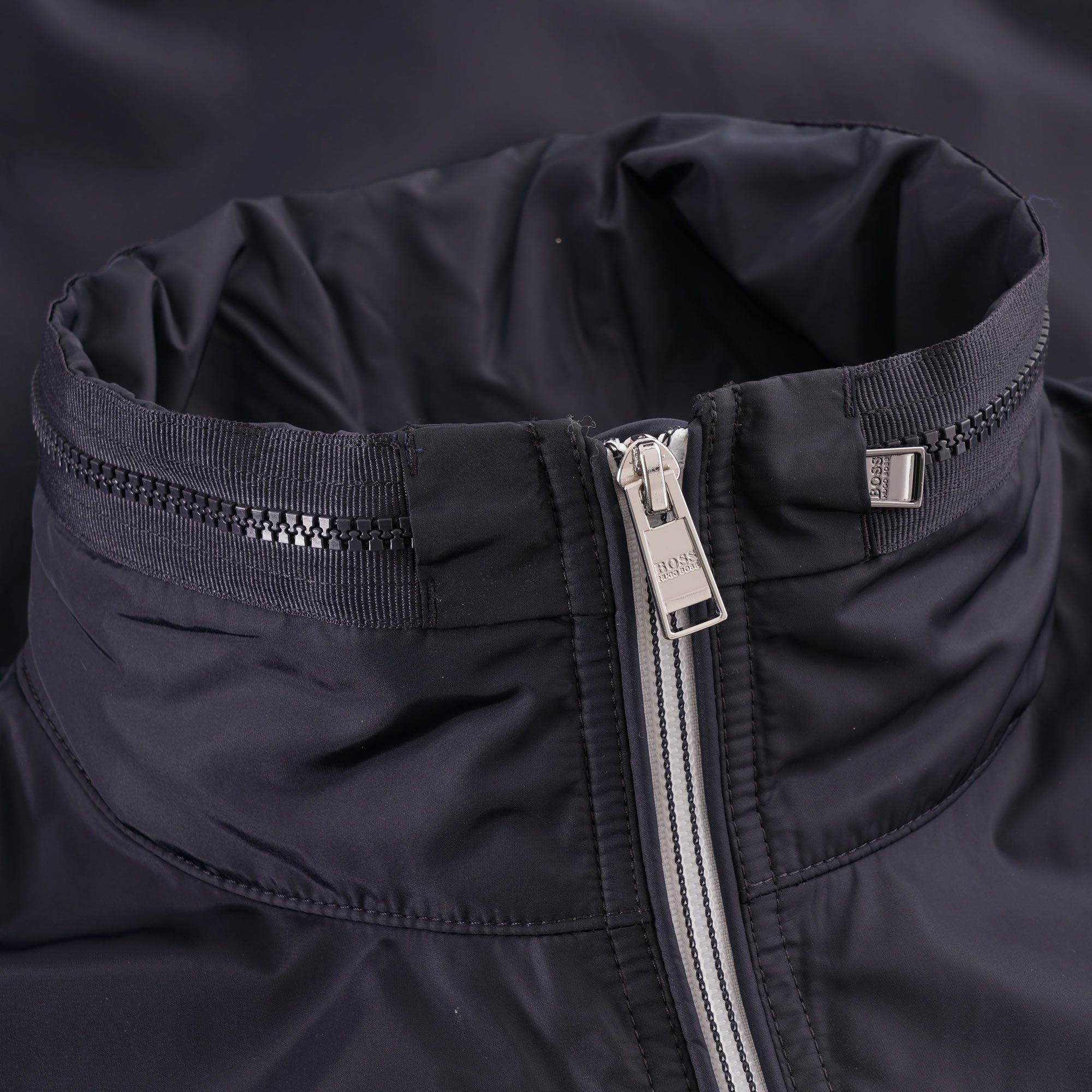 Close-up of the jacket collar, showing the zip and collar details.