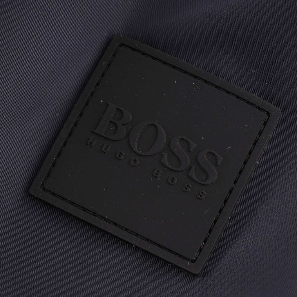 Close-up of the BOSS Hugo Boss logo patch on the jacket.