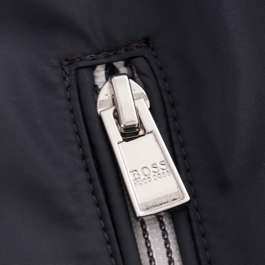 Close-up of the jacket's pocket zip with a branded BOSS Hugo Boss puller.