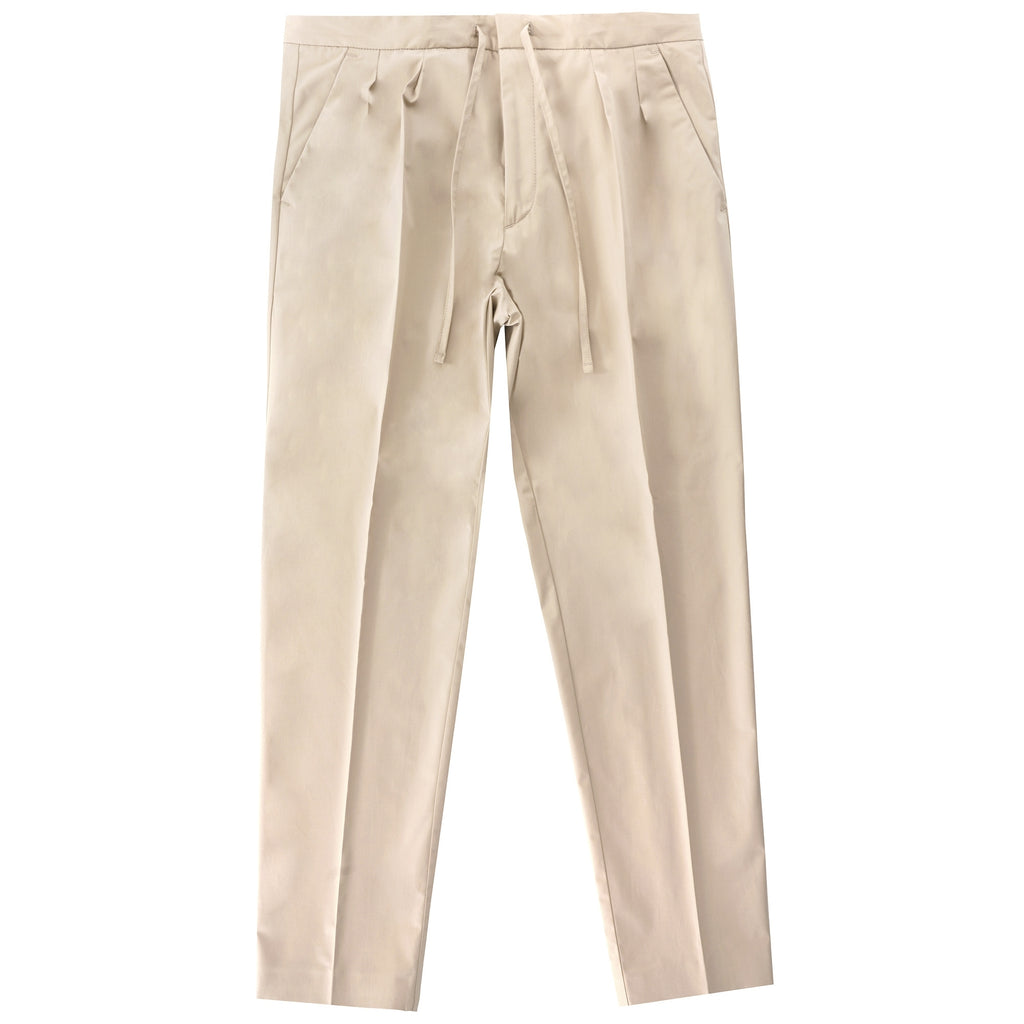 Front view of beige trousers with a drawstring waist.