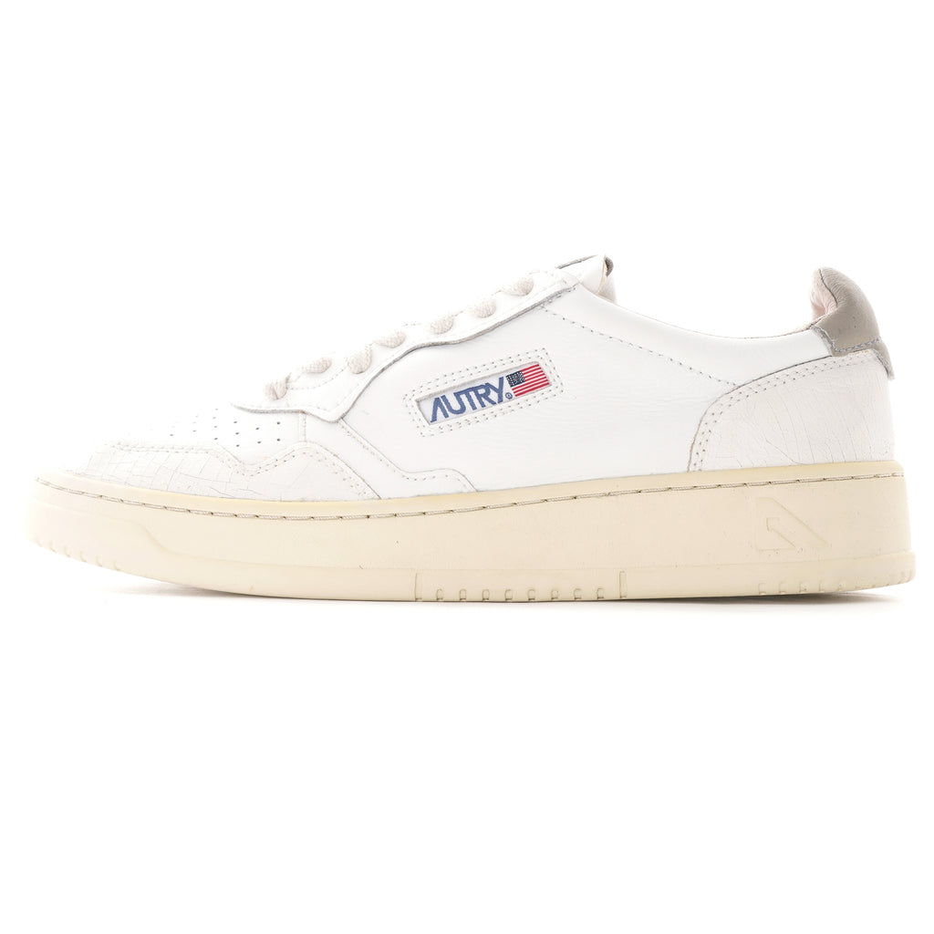 A single white Autry Medalist trainer, side view, on a white background.