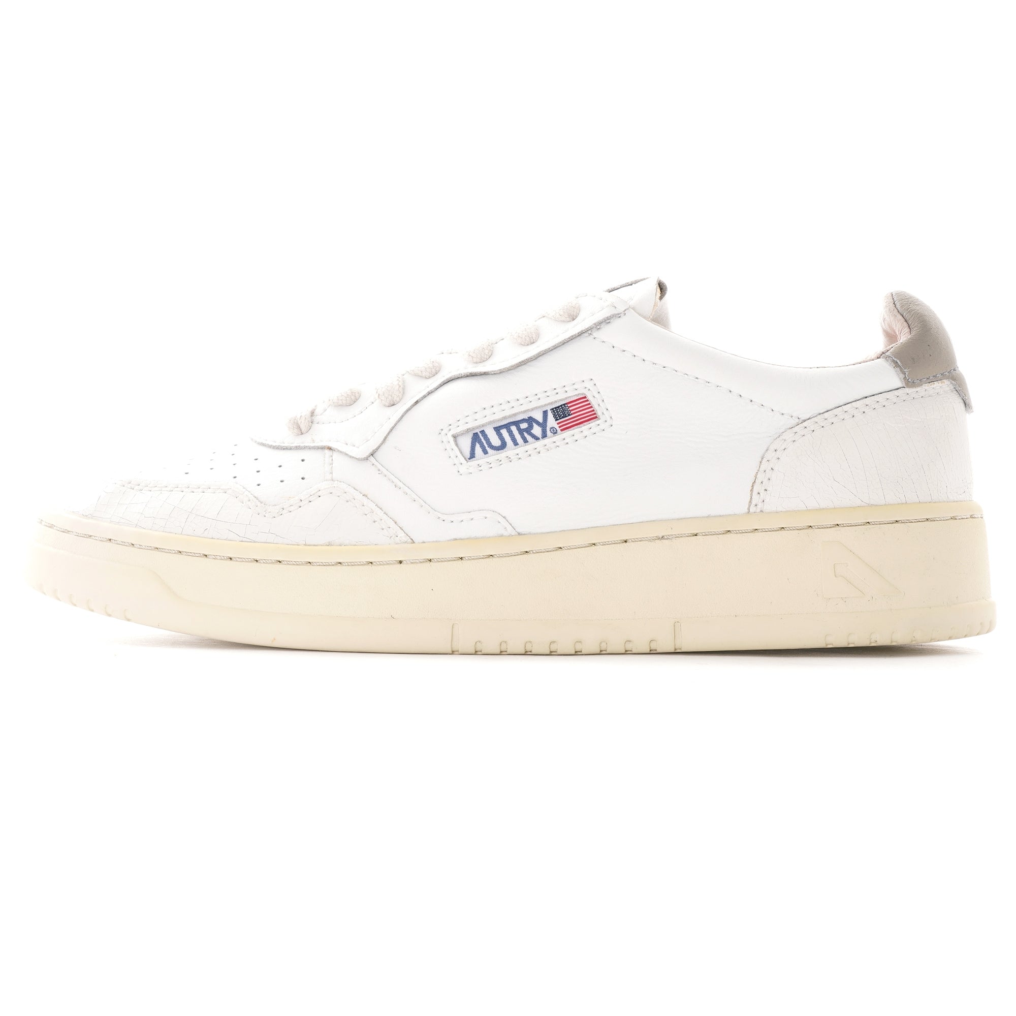 A single white Autry Medalist trainer, side view, on a white background.