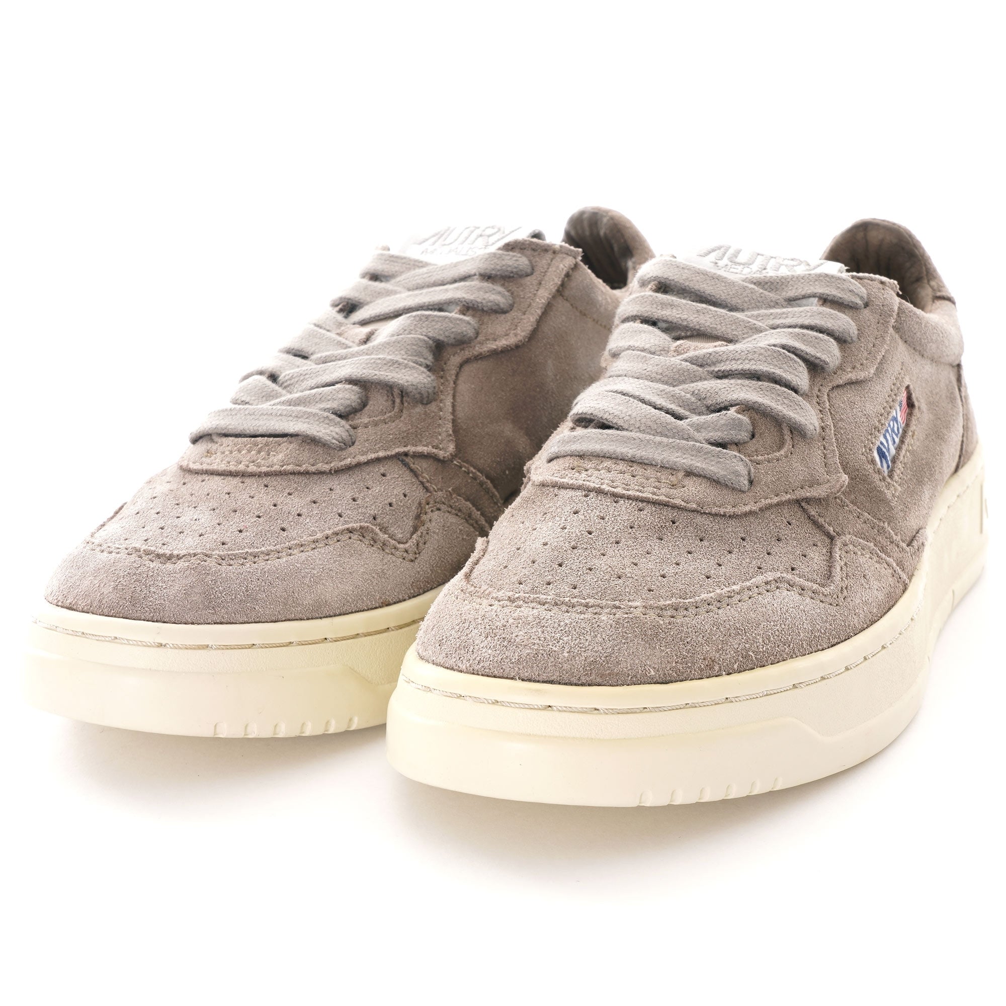 A pair of Autry Medalist Low sneakers in grey suede, with white soles, viewed from the front.