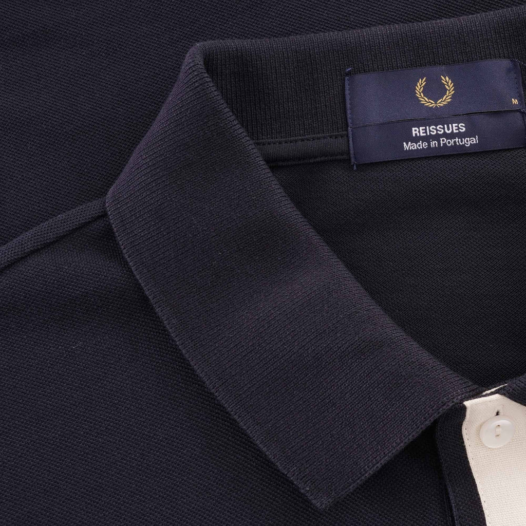 A close-up of the shirt's collar and tag, showing it is a Fred Perry Reissues product.