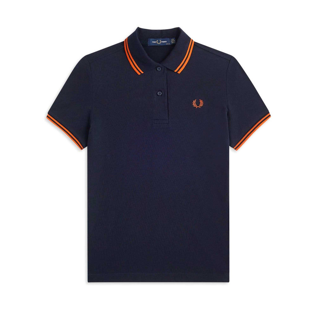 A navy polo shirt with orange tipping on the collar and cuffs, featuring a subtle embroidered logo.