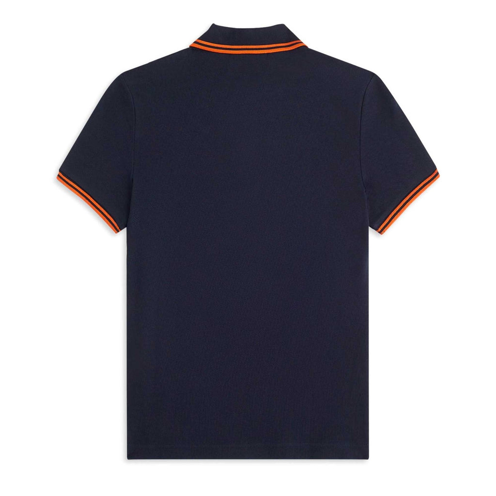 The rear view of a navy polo shirt, with orange tipping on the collar and sleeve cuffs.
