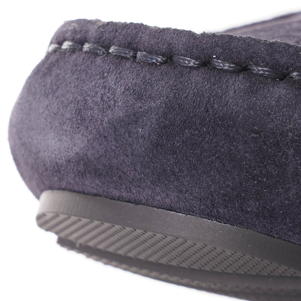 A close-up of the loafer's stitched upper and the textured rubber sole.