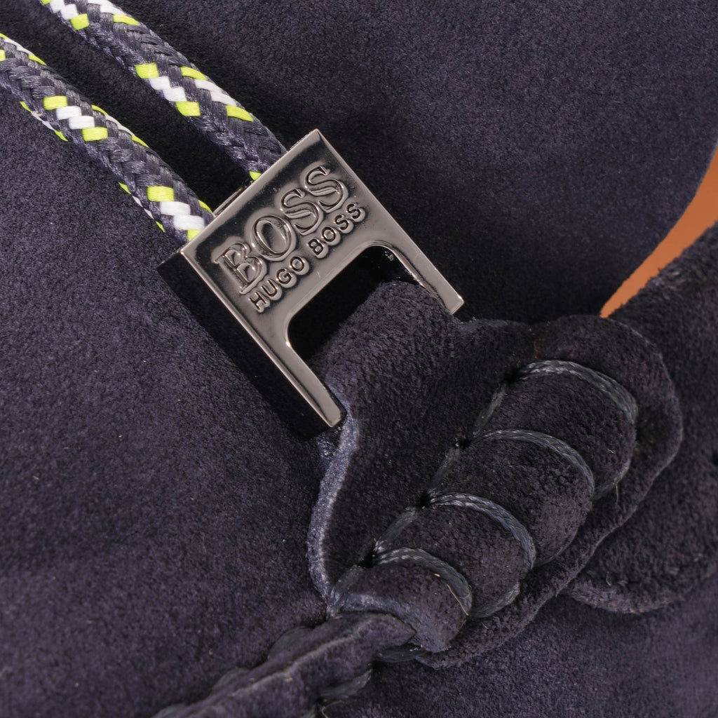 A close-up of the silver BOSS logo buckle with striped cord detailing.