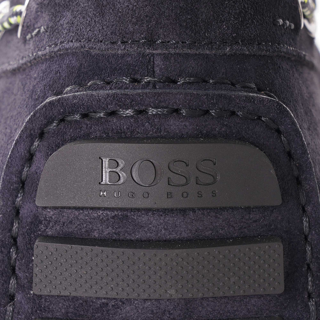 A close-up of the embossed BOSS Hugo Boss logo on the heel of the loafer.