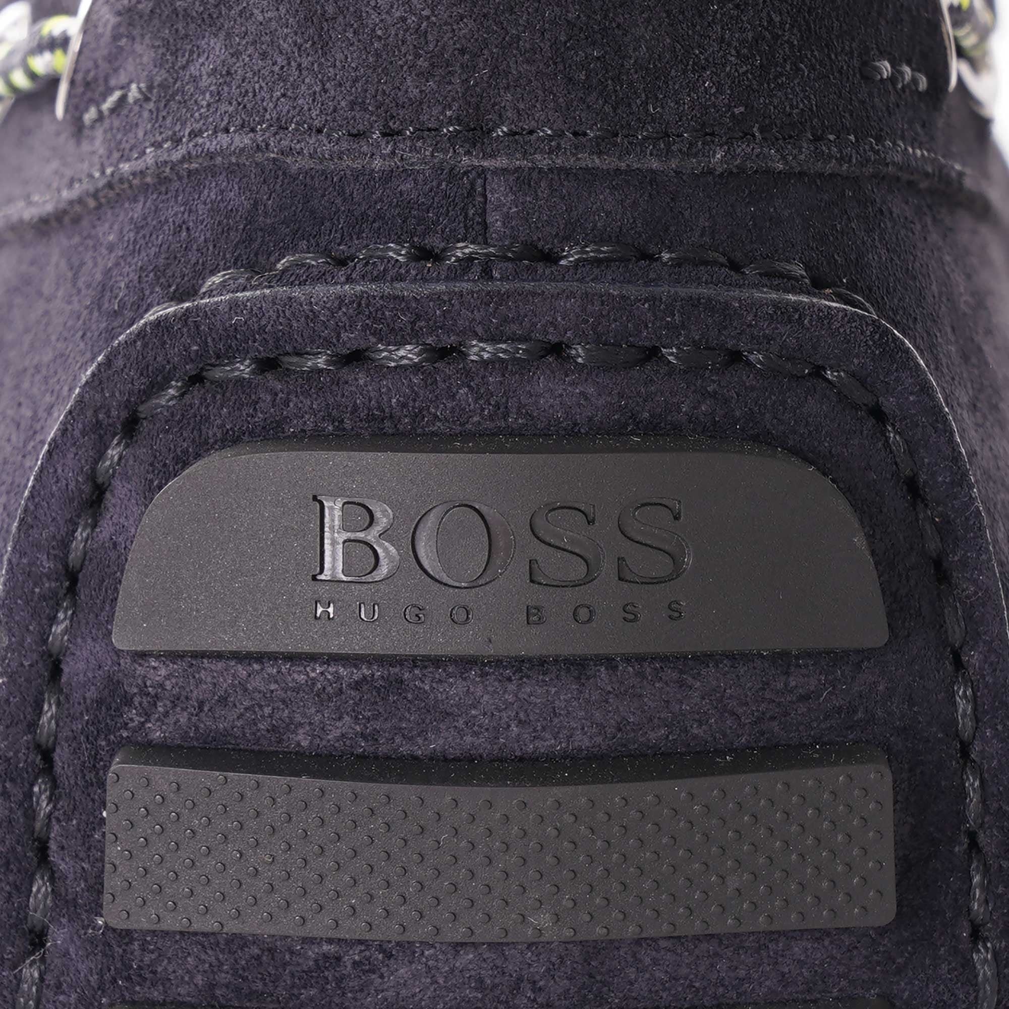 A close-up of the embossed BOSS Hugo Boss logo on the heel of the loafer.