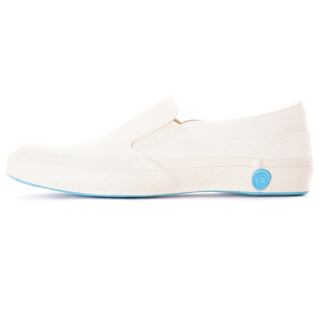 A single white slip-on canvas shoe with a light blue sole is shown from the side.