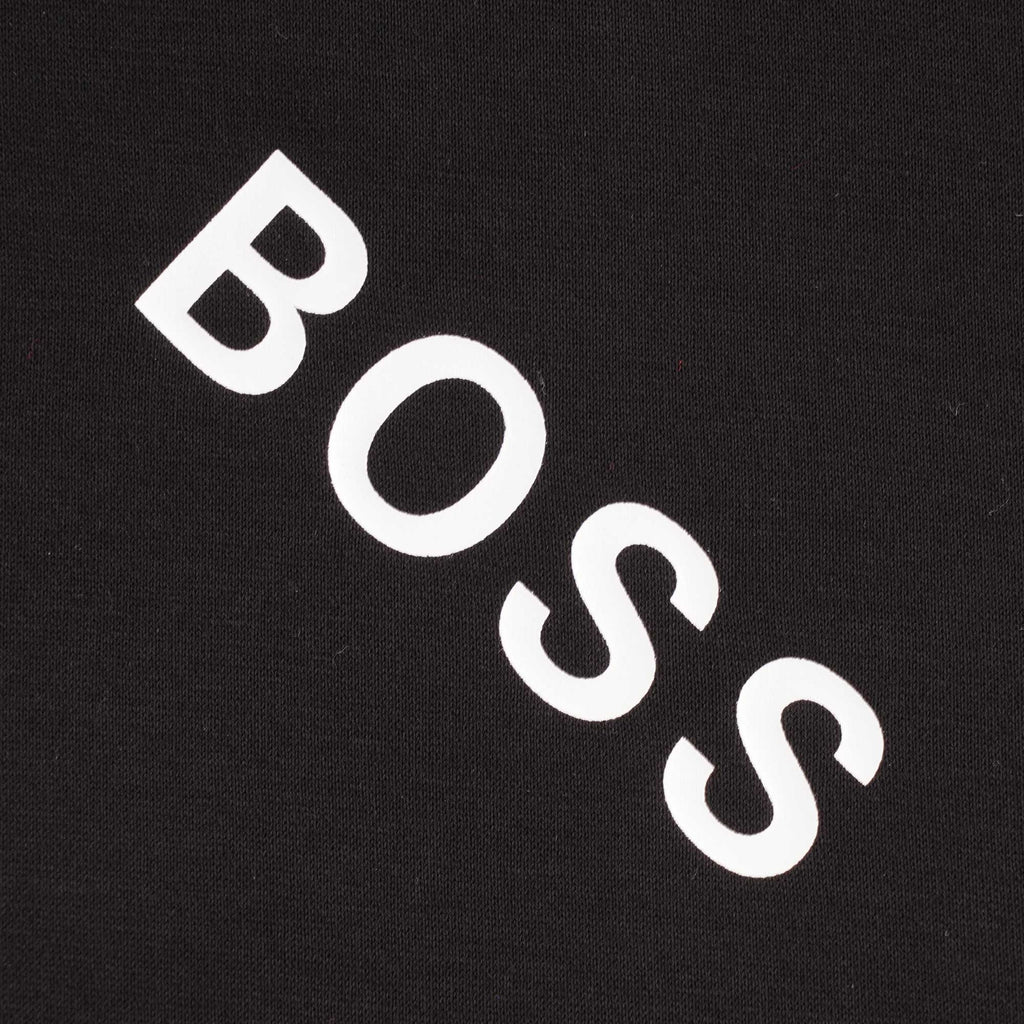Close-up of a white diagonal 'BOSS' logo on the black t-shirt.