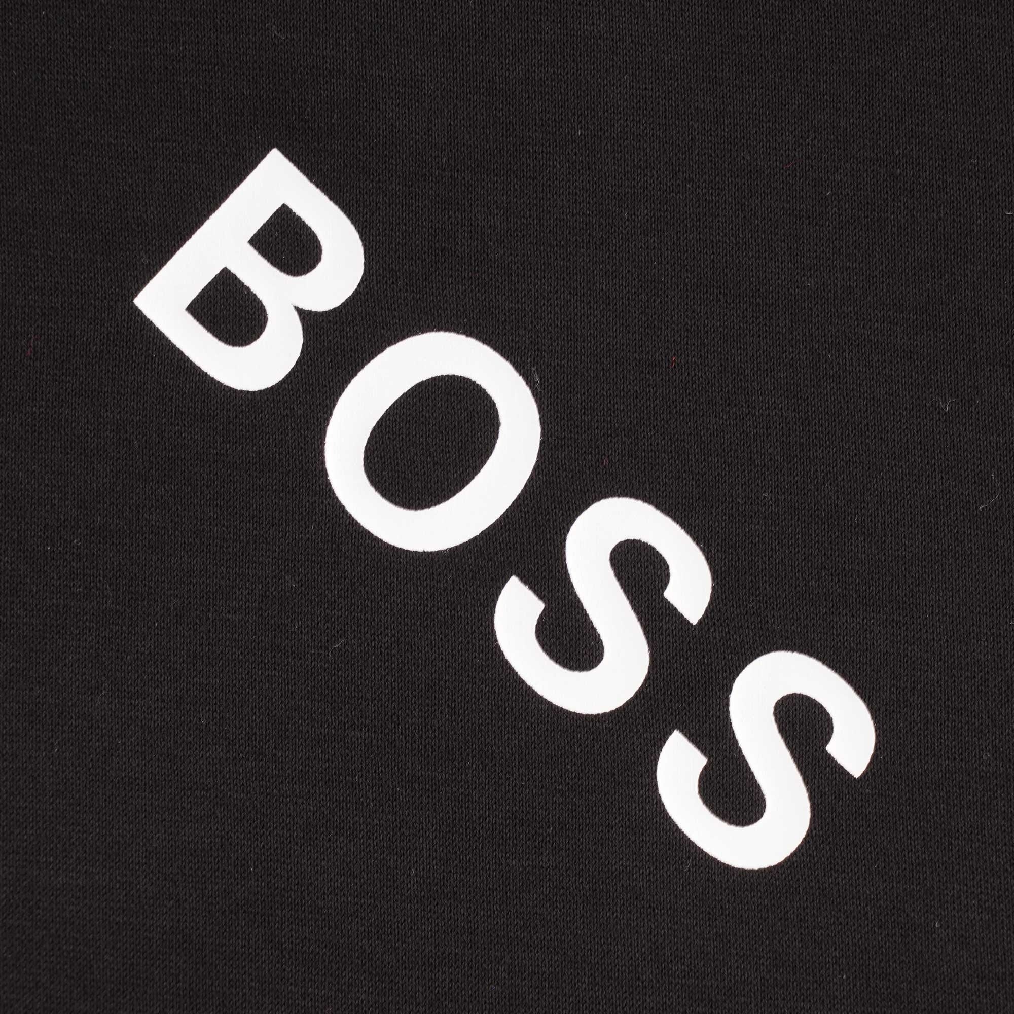 Close-up of a white diagonal 'BOSS' logo on the black t-shirt.