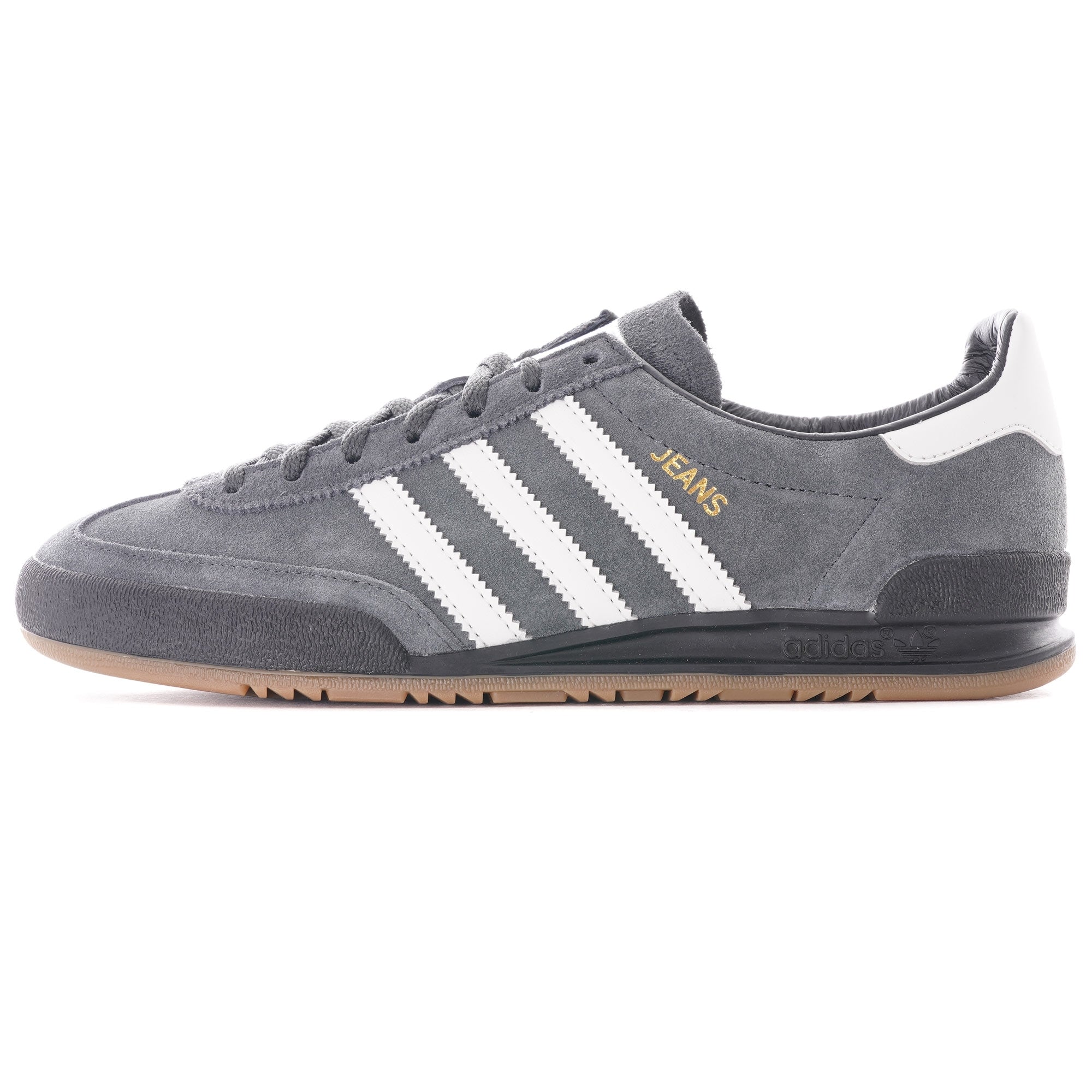 A grey Adidas Jeans trainer with white stripes and a brown sole, viewed from the side.
